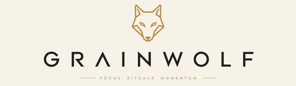 Grain Wolf official logo featuring a minimalist gold geometric wolf head icon and the text Focus, Rituals, Momentum.